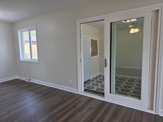 1449 Kristan Ave, North Chicago, IL 60064 - empty room with dark wood-style flooring and baseboards