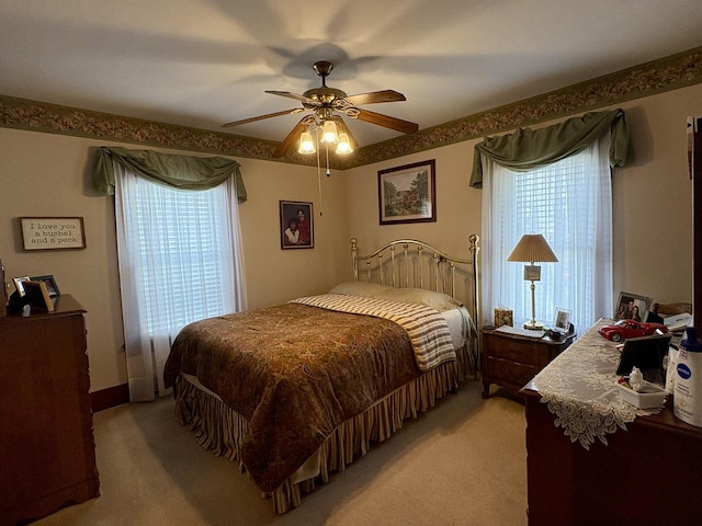 1112 W Wilmington-Peotone Rd, Peotone, IL 60468 - bedroom featuring light carpet, multiple windows, and a ceiling fan