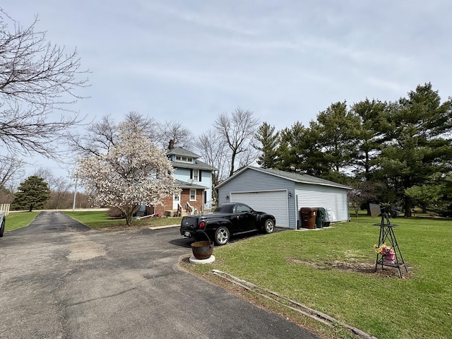 1112 W Wilmington-Peotone Rd, Peotone, IL 60468 - view of front of home with a garage, an outdoor structure, and a front yard