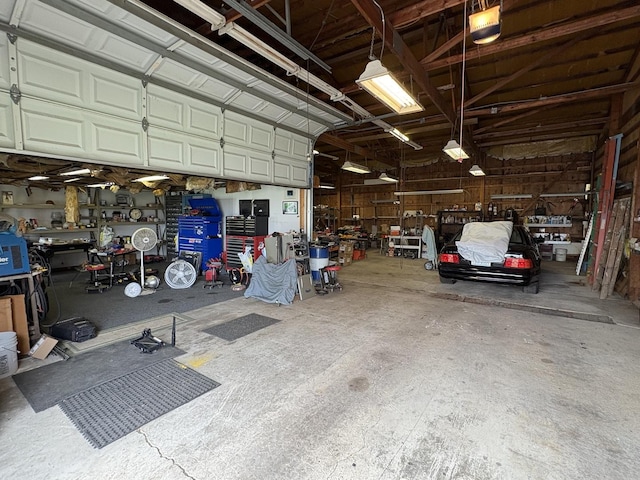 1112 W Wilmington-Peotone Rd, Peotone, IL 60468 - garage with a workshop area and a garage door opener