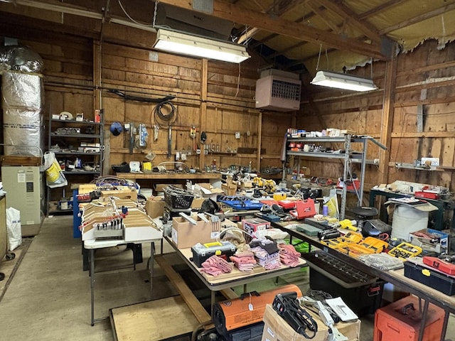 1112 W Wilmington-Peotone Rd, Peotone, IL 60468 - miscellaneous room with a workshop area, wooden walls, and concrete flooring