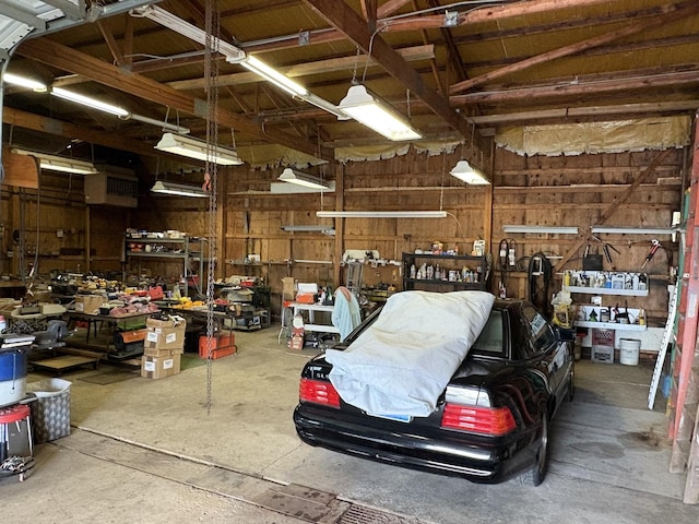 1112 W Wilmington-Peotone Rd, Peotone, IL 60468 - garage featuring a workshop area and wooden walls