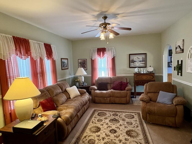 1112 W Wilmington-Peotone Rd, Peotone, IL 60468 - carpeted living room featuring a ceiling fan and arched walkways