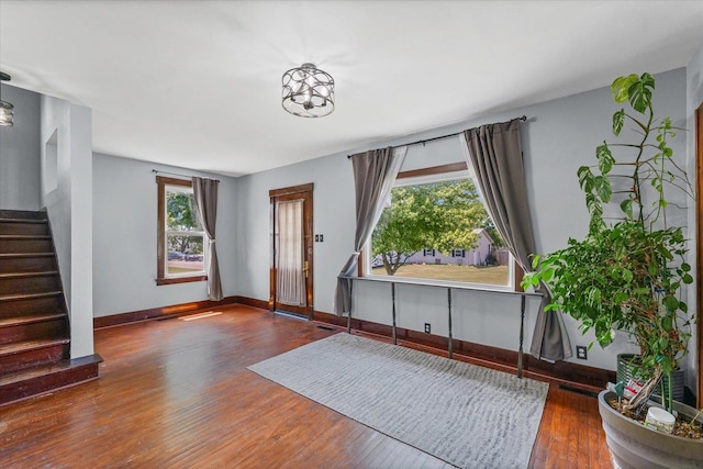103 S Locust St, Loda, IL 60948 - entryway with stairs, wood finished floors, and a chandelier