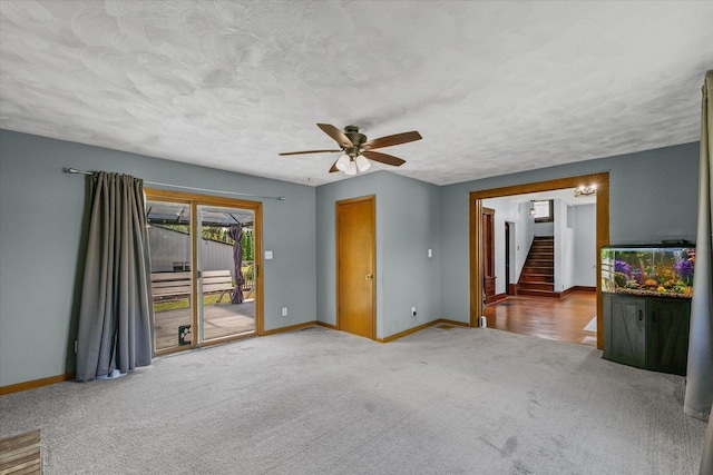 103 S Locust St, Loda, IL 60948 - carpeted spare room featuring stairs, ceiling fan, and a textured ceiling