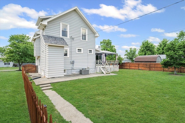 103 S Locust St, Loda, IL 60948 - rear view of house with a patio area, a fenced backyard, a gazebo, and roof with shingles