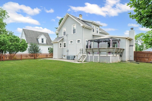 103 S Locust St, Loda, IL 60948 - back of house with a gazebo, a chimney, a patio, a fenced backyard, and a deck