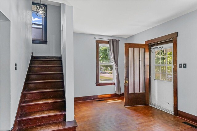 103 S Locust St, Loda, IL 60948 - foyer entrance featuring wood finished floors, stairs, and plenty of natural light
