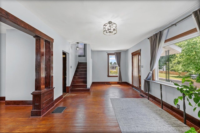 103 S Locust St, Loda, IL 60948 - foyer featuring wood finished floors, stairway, and decorative columns