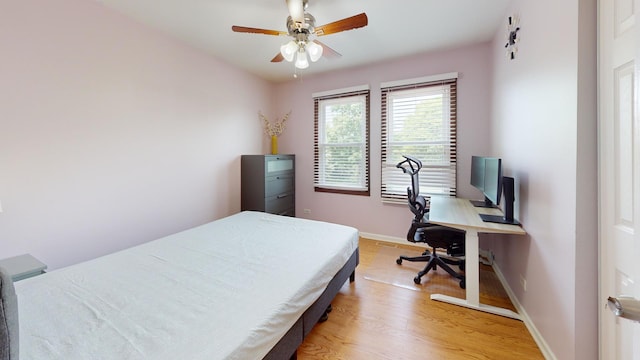 1005 N Dovington Dr, Hoffman Estates, IL 60169 - bedroom with light wood-style flooring, an office area, and a ceiling fan