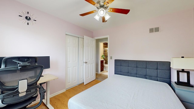 1005 N Dovington Dr, Hoffman Estates, IL 60169 - bedroom with light wood-style floors, an office area, a closet, and a ceiling fan