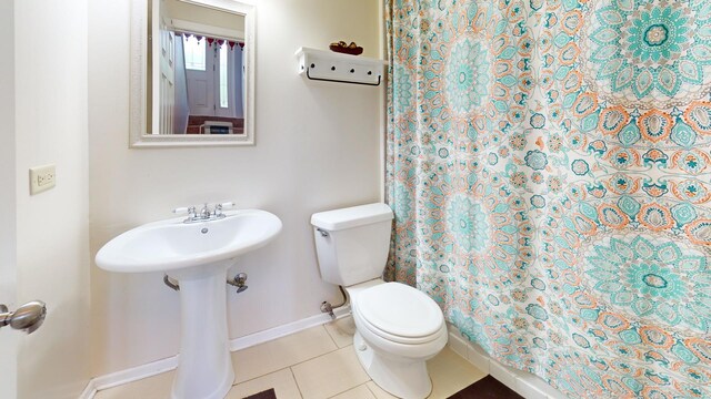 1005 N Dovington Dr, Hoffman Estates, IL 60169 - bathroom with tile patterned flooring and curtained shower