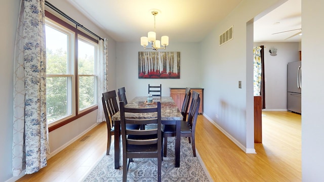 1005 N Dovington Dr, Hoffman Estates, IL 60169 - dining space featuring light wood-type flooring and a chandelier