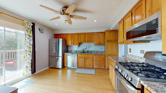 1005 N Dovington Dr, Hoffman Estates, IL 60169 - kitchen featuring stainless steel appliances, a ceiling fan, light wood-style floors, light stone countertops, and recessed lighting