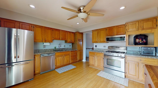 1005 N Dovington Dr, Hoffman Estates, IL 60169 - kitchen featuring stainless steel appliances, ceiling fan, light wood-style floors, light stone countertops, and recessed lighting