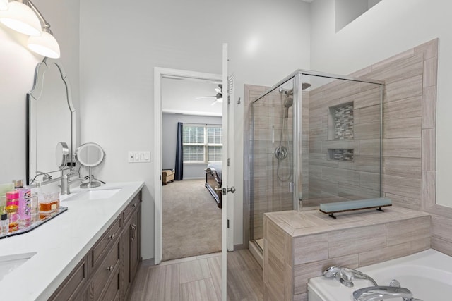 2503 Red Hawk Ridge Ct, Aurora, IL 60503 - full bathroom with ceiling fan, a shower stall, ensuite bath, a garden tub, and double vanity
