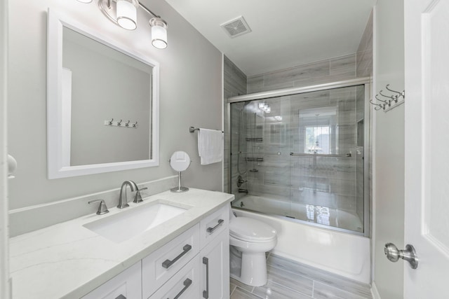 2503 Red Hawk Ridge Ct, Aurora, IL 60503 - bathroom featuring vanity and combined bath / shower with glass door