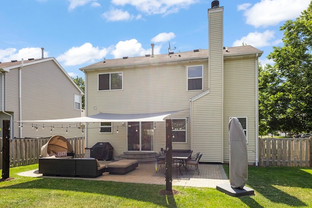 2503 Red Hawk Ridge Ct, Aurora, IL 60503 - rear view of property featuring an outdoor living space, a fenced backyard, a patio, a chimney, and entry steps