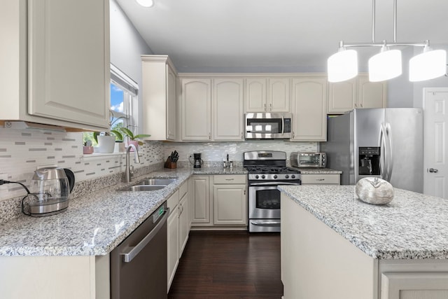 2503 Red Hawk Ridge Ct, Aurora, IL 60503 - kitchen with stainless steel appliances, dark wood finished floors, decorative backsplash, and light stone counters