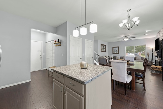 2503 Red Hawk Ridge Ct, Aurora, IL 60503 - kitchen with a chandelier, a center island, ceiling fan, dark wood-style flooring, and open floor plan
