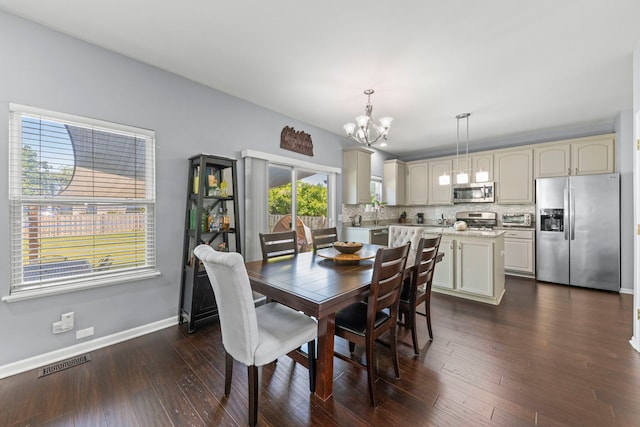 2503 Red Hawk Ridge Ct, Aurora, IL 60503 - dining space featuring a chandelier and dark wood finished floors