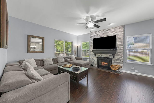 2503 Red Hawk Ridge Ct, Aurora, IL 60503 - living area featuring dark wood finished floors, a stone fireplace, and ceiling fan