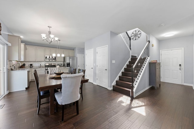 2503 Red Hawk Ridge Ct, Aurora, IL 60503 - dining space with a chandelier, stairs, and dark wood-type flooring
