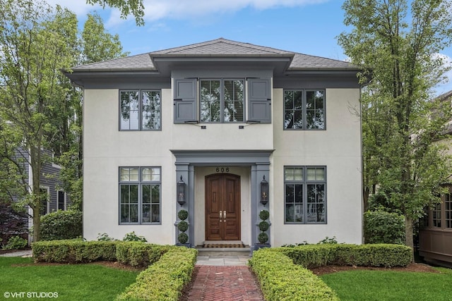 606 S Washington St, Hinsdale, IL 60521 - view of front facade with stucco siding, a shingled roof, and a front lawn