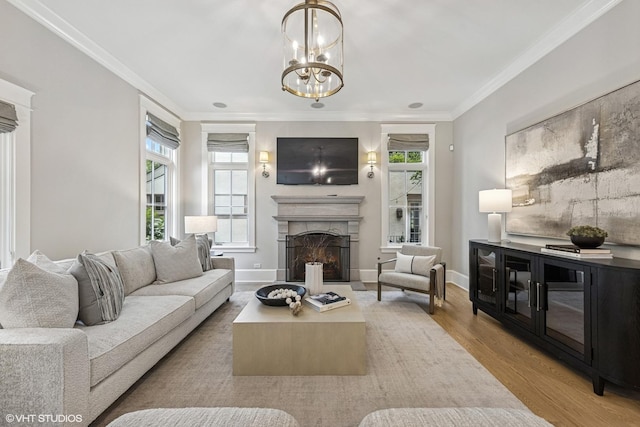 606 S Washington St, Hinsdale, IL 60521 - living room with wood finished floors, a fireplace, ornamental molding, and a chandelier