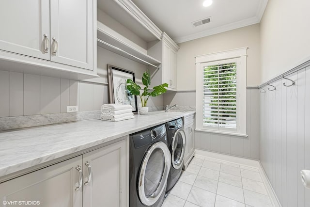 606 S Washington St, Hinsdale, IL 60521 - laundry room with cabinet space, washing machine and clothes dryer, crown molding, and light marble finish flooring