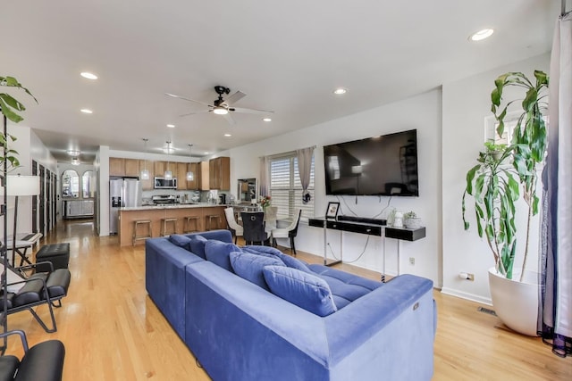 1900 N Laramie Ave, Chicago, IL 60639 - living room with light wood-style floors, ceiling fan, and recessed lighting