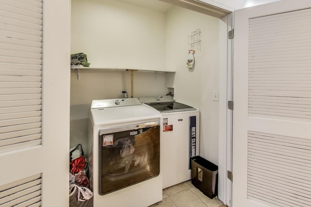 1900 N Laramie Ave, Chicago, IL 60639 - laundry room featuring washing machine and dryer and light tile patterned floors