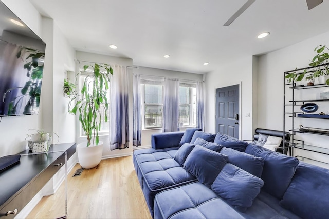 1900 N Laramie Ave, Chicago, IL 60639 - living room with light wood-style floors, ceiling fan, and recessed lighting