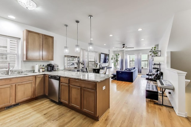 1900 N Laramie Ave, Chicago, IL 60639 - kitchen featuring dishwasher, a peninsula, light wood-type flooring, light stone counters, and recessed lighting