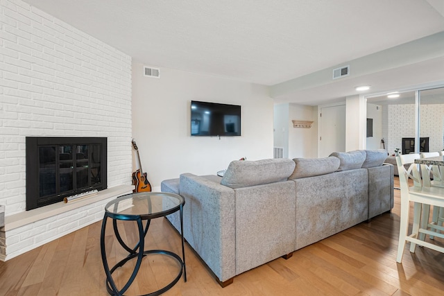 9197 N Rd Unit C, Palos Hills, IL 60465 - living room featuring a fireplace and wood finished floors