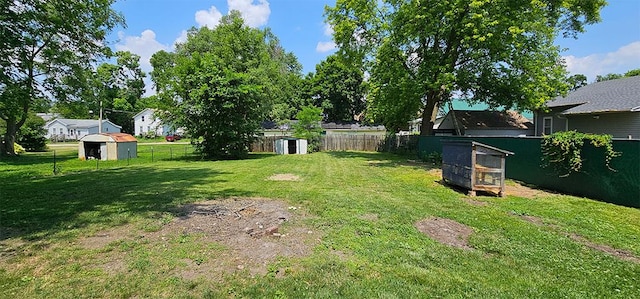 909 W 6th St, Dixon, IL 61021 - fenced backyard featuring a storage unit