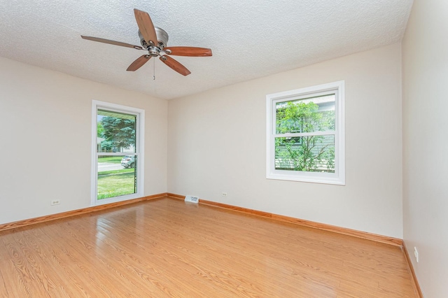 741 Gates St, West Chicago, IL 60185 - unfurnished room with wood finished floors, a textured ceiling, and a ceiling fan
