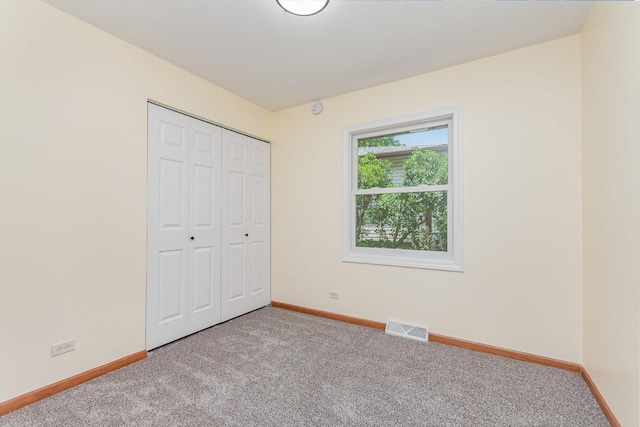 741 Gates St, West Chicago, IL 60185 - unfurnished bedroom featuring carpet and a closet