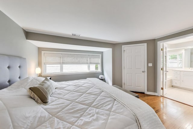 1311 E Woodford Pl, Arlington Heights, IL 60004 - bedroom with wood finished floors and ensuite bathroom