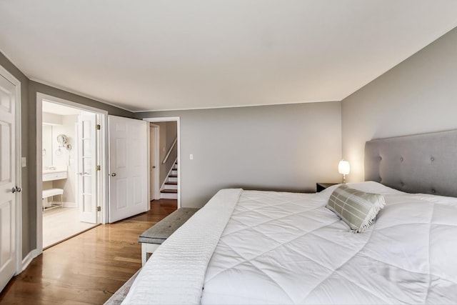 1311 E Woodford Pl, Arlington Heights, IL 60004 - bedroom featuring wood finished floors and ensuite bathroom