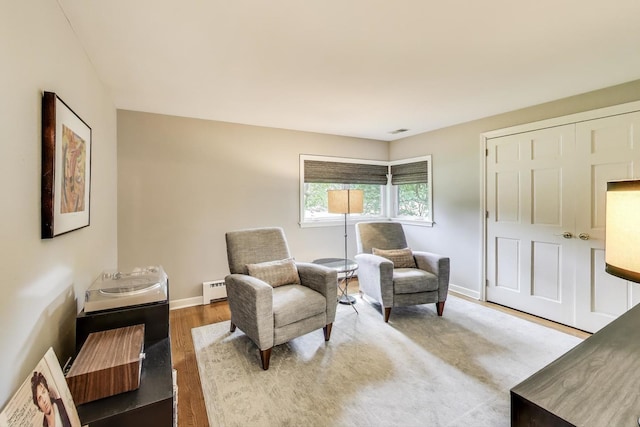 1311 E Woodford Pl, Arlington Heights, IL 60004 - sitting room featuring a baseboard heating unit and wood finished floors