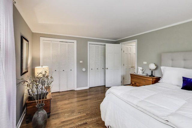 1311 E Woodford Pl, Arlington Heights, IL 60004 - bedroom featuring multiple closets, wood finished floors, and crown molding