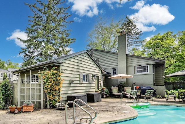 1311 E Woodford Pl, Arlington Heights, IL 60004 - back of property with a patio area and a chimney