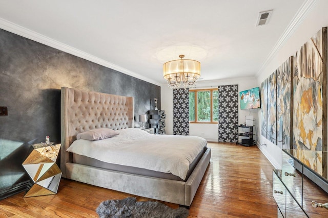 318 10th St, Wheeling, IL 60090 - bedroom featuring crown molding, a chandelier, and wood finished floors