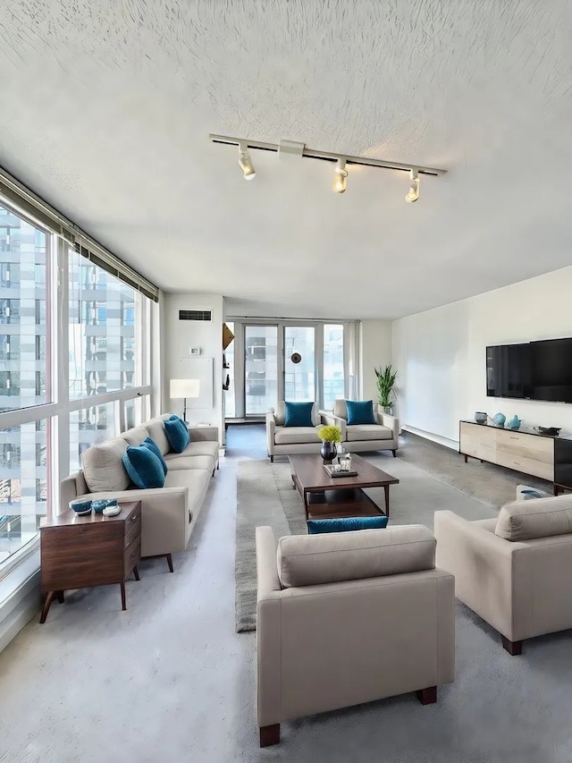 200 N Dearborn St Unit 4306, Chicago, IL 60601 - living area featuring rail lighting and finished concrete floors