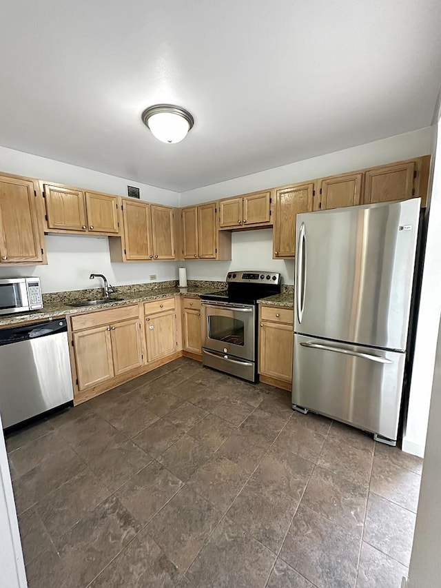 200 N Dearborn St Unit 4306, Chicago, IL 60601 - kitchen featuring appliances with stainless steel finishes, dark stone countertops, and dark stone finish floors