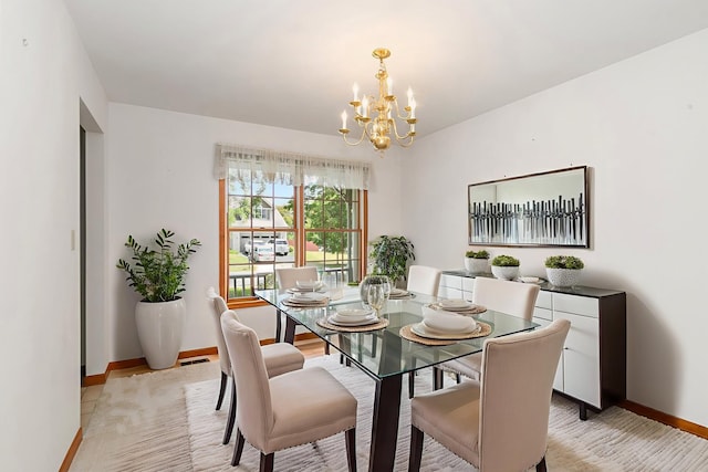 905 Pember Cir, West Dundee, IL 60118 - dining room featuring a chandelier and light wood-style flooring