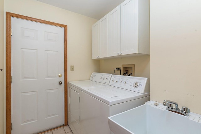 905 Pember Cir, West Dundee, IL 60118 - laundry area featuring cabinet space, washer and dryer, and light tile patterned flooring