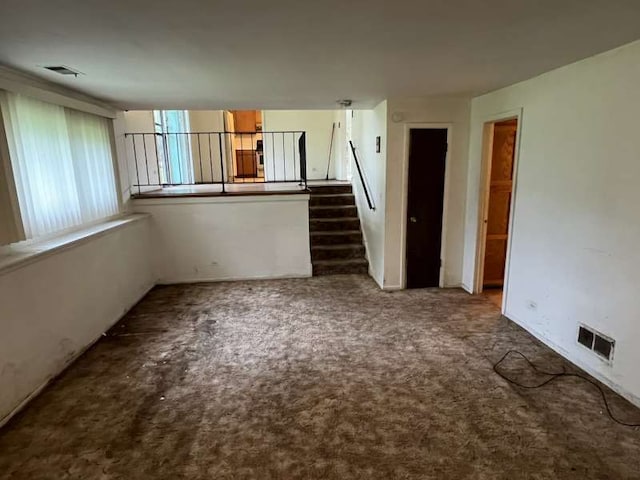 1116 Amherst Ln, University Park, IL 60484 - empty room with stairway and carpet flooring