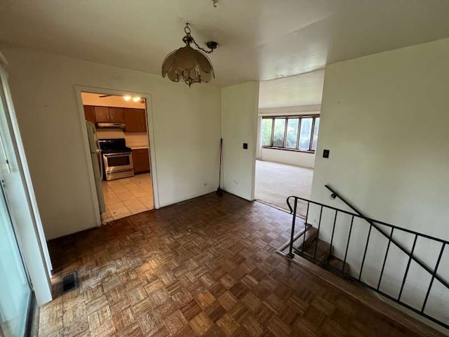 1116 Amherst Ln, University Park, IL 60484 - unfurnished room with a chandelier and baseboards